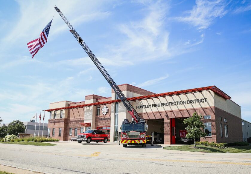 Huntley fire station flag on ladder truck