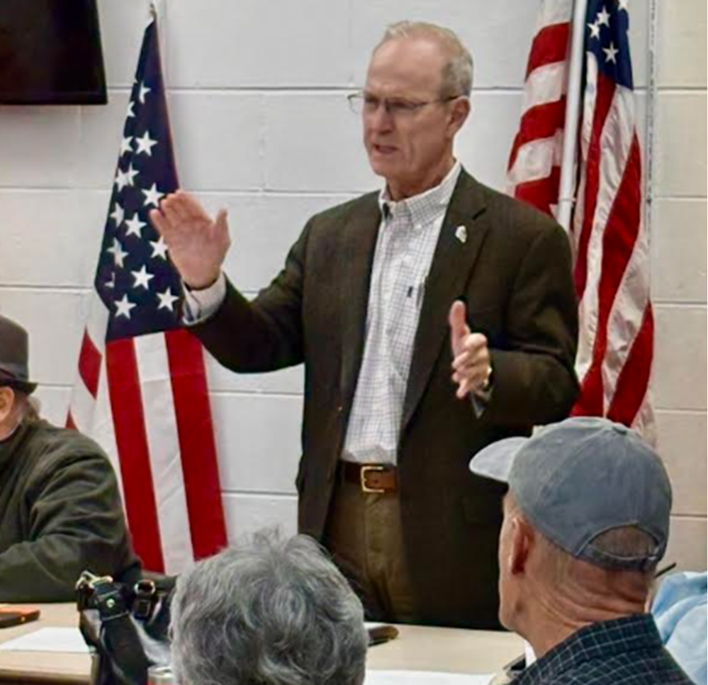 Tracy 12-25 GOP Exec com meeting arms out