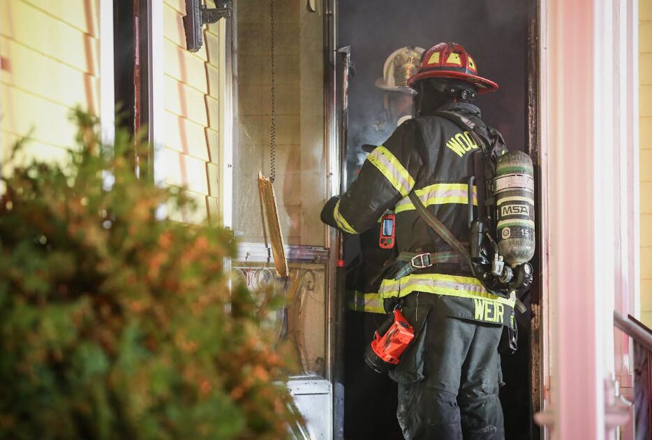 Wdstk firemen at door of house